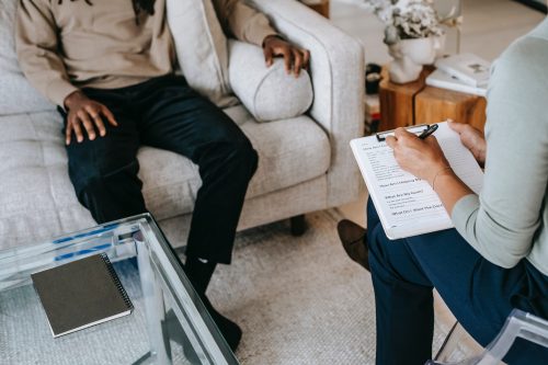 Therapist and client sitting in appointment